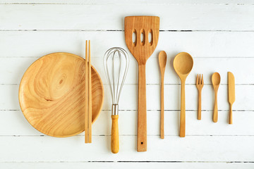 Overhead view of wood utensils and chalkboard on wood board back