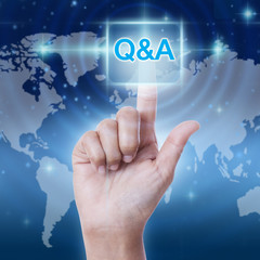 hand pressing Q & A sign button on virtual screen