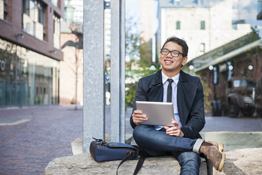 Young Asian Man With Digital Tablet