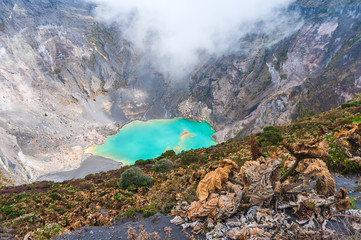 Main crater of Irazu Volcano with emerald lake  and mist. Central America. Costa Rica