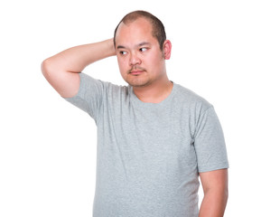 Obraz premium Asian man feeling itching his head