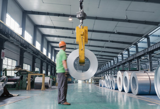 Worker in solar panel assembly factory, Solar Valley, Dezhou, China