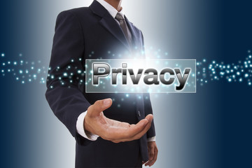 Businessman hand showing privacy button on virtual screen.