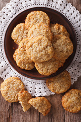 Freshly baked Australian ANZAC biscuits close up. Vertical top view
