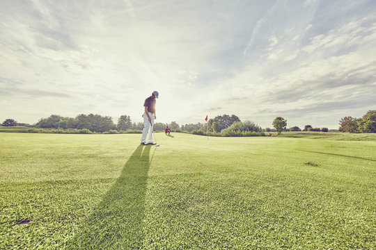 Golfer on course, Korschenbroich, Dusseldorf, Germany