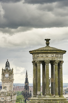 Elevated cityscape with Dugald Stewart monument and Scotts monument, Edinburgh, Scotland, UK