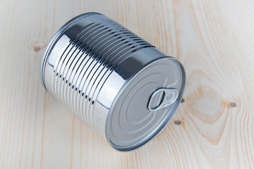 Tin cans for food on wooden background