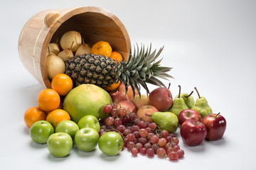 bucket with tropical fruits