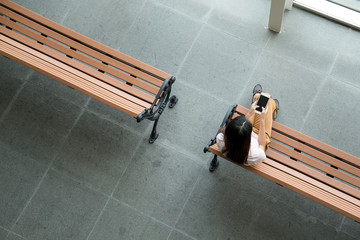 Top view of woman using smart phone