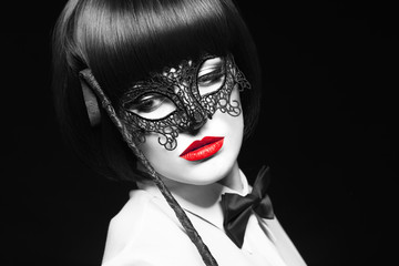 Sexy woman with red lips and whip selective coloring