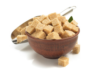 brown sugar cubes in bowl on white
