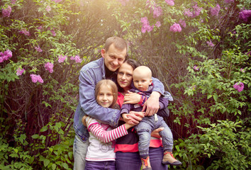 Fototapeta premium Happy young family in the garden