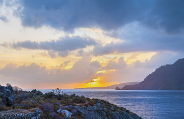 Atmospheric sunset in a beautiful bay near the Mediterranean village of Plakias.Panoramic view.Crete island.District of Rethymno.Greece.Europe.