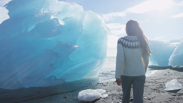 Iceland, Jokulsarlon Iceberg beach / Ice beach. People looking at icebergs on breidamerkursandur beach by jokulsarlon glacial lagoon, Vatnajokull National Park landscape. RED EPIC, 96 FPS, SLOW MOTION
