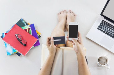  Top view lady sitting and hands hold credit or debit card with