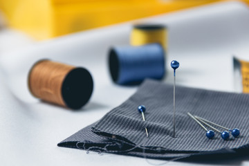 Accessories for needlework on white cloth background