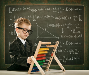 young clever scientist children students with abacus and blackboard