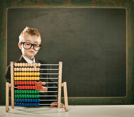 young clever scientist children students with abacus and blackboard