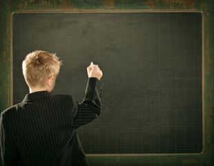 young clever scientist children students write on  blackboard