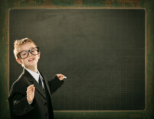 young clever scientist children students write on  blackboard