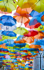 Street decorated with colored umbrellas.