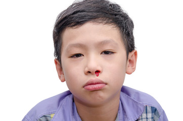 Young Asian boy with bleeding from nose over white