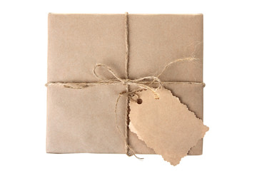 one small parcel tied with a rope with a tag on white isolated background