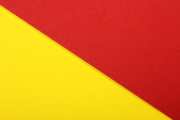 Color papers geometry flat composition background with yellow and red tones