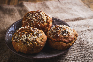 Freshly baked homemade bread on rustic wood background