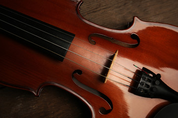 Fototapeta premium Violin on wooden background