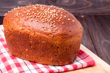 Black bread with fresh coriander closeup