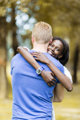 Couple in love hugging peacfully outdoors