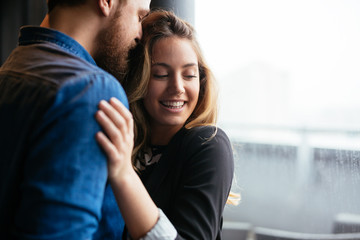 Fototapeta premium Happy couple hugging and sharing emotions