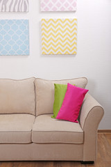 Couch with pillows in light room
