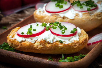 Toasts with radish, chives and cottage cheese.