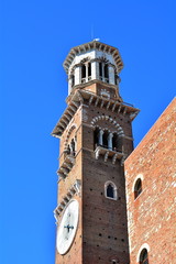 Fototapeta na wymiar The medieval tower in Verona, tthe Lamberti's tower with the big clock. Italy