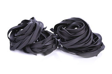 Squid ink pasta on white background
