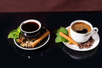 Black Coffee in Black and White Cups with Spices