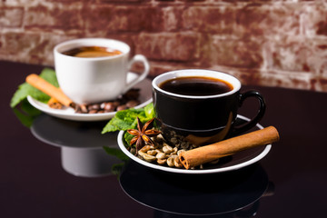 Black Coffee in Black and White Cups with Spices