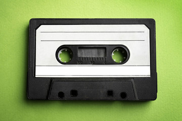 Old audio cassette on red background