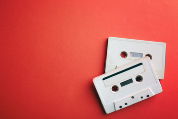 Old audio cassettes on red background