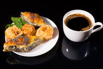Gourmet Pastries and Black Coffee on Black Table