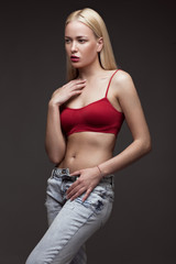 sexy  fashion model with long hair, young European attractive, beautiful eyes, full lips, perfect skin is posing in studio for glamour vogue test photo shoot showing different poses