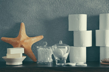 Bath accessories on grey wall background