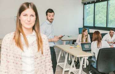 Start up office. Businessman watching lady buttock while passing