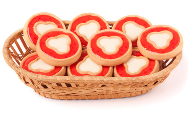 Fototapeta na wymiar cookies with jelly in wicker basket isolated on white background