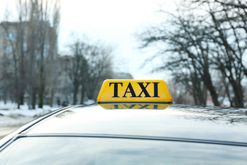 Taxi sign on car outdoor, closeup