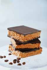 Tasty homemade cakes with chocolate on light background