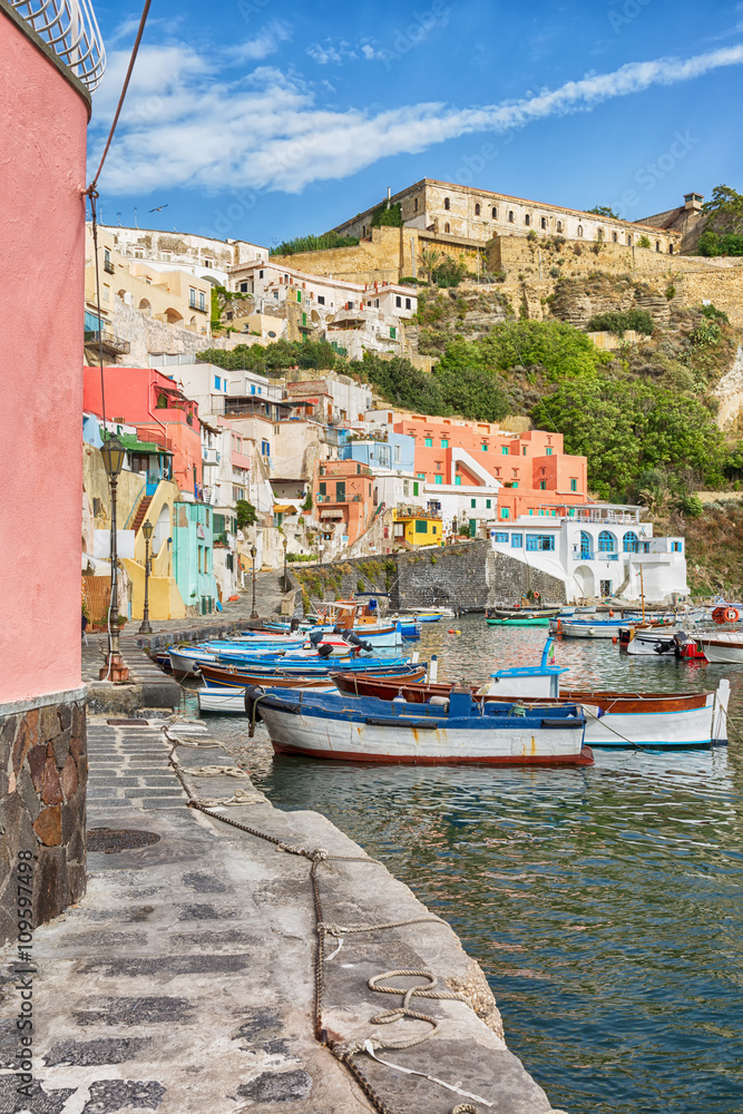 Sticker Picturesque landmark in Italy with fishing-boats and pastel coloured buildings.