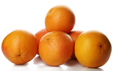 Pile of grapefruits isolated on white background